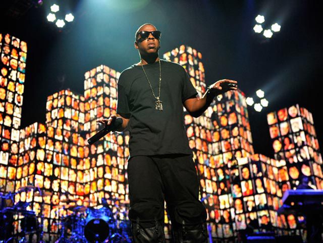 Jay-Z, in front of 9/11 victims' photos